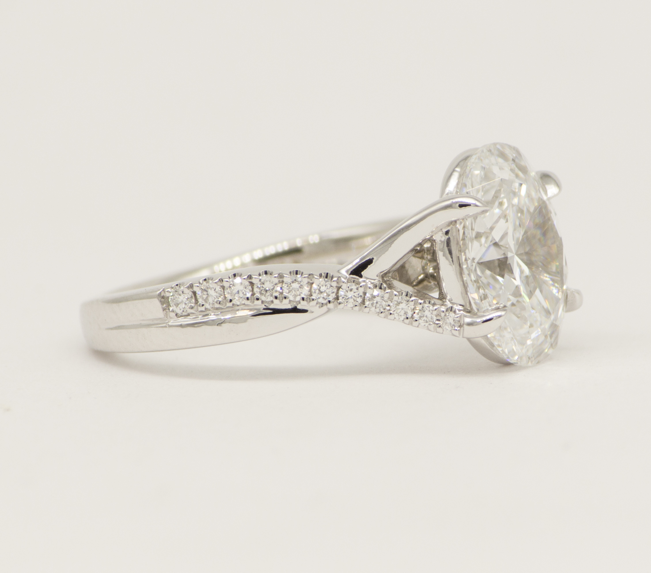 Engagement Ring with oval lab diamond and accented split shank twist